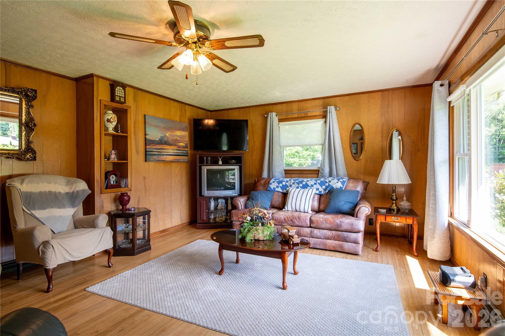 40 Double Island Road Burnsville, NC 28714 - Photo 11 of 38 a living room with furniture and a chandelier