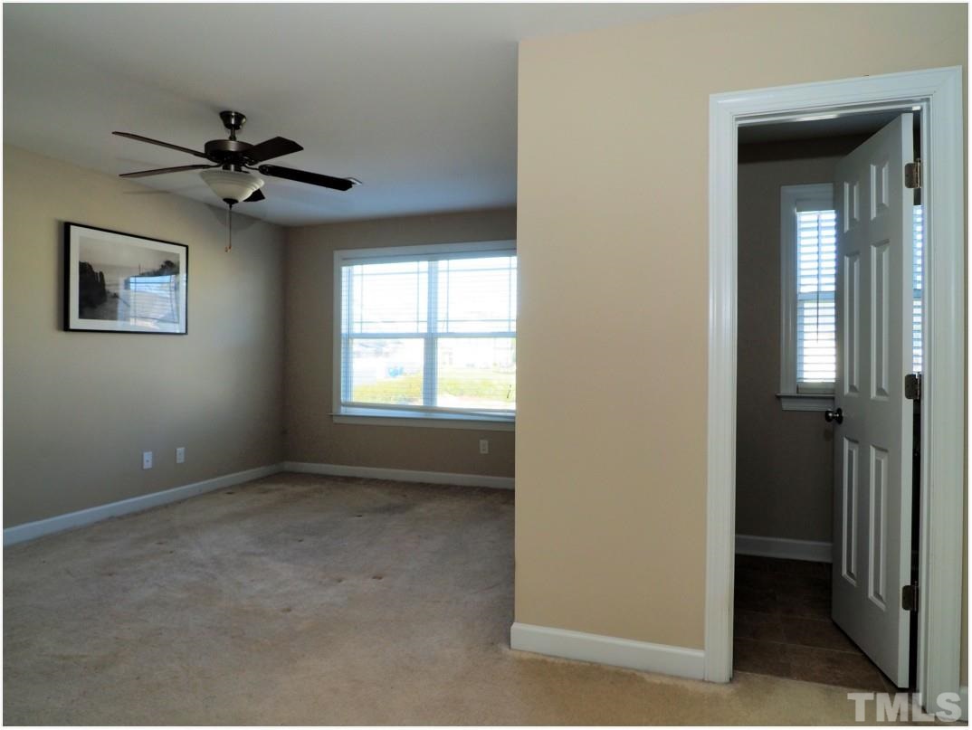 3511 Provost Street Raleigh, NC 27603 - Photo 12 of 24 Walk in closet and ceiling fan in Master