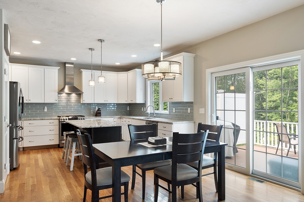46 Jordan Road Holden, MA 01520 - Photo 3 of 42 a kitchen with kitchen island a dining table and chairs