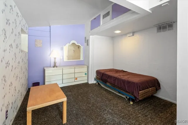 a room with a bed and a chair