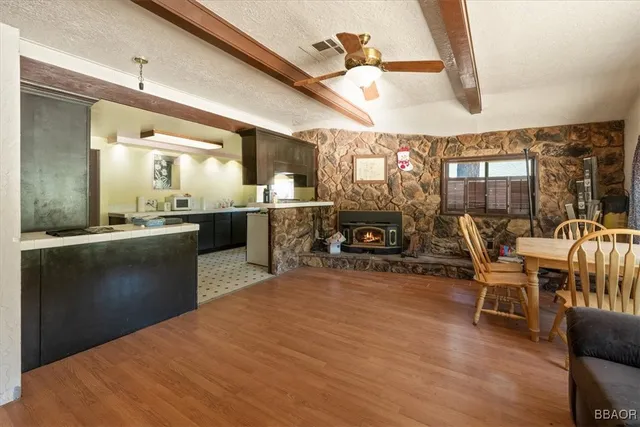 a kitchen with stainless steel appliances granite countertop a sink and cabinets
