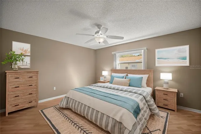 a view of an empty room with a fan