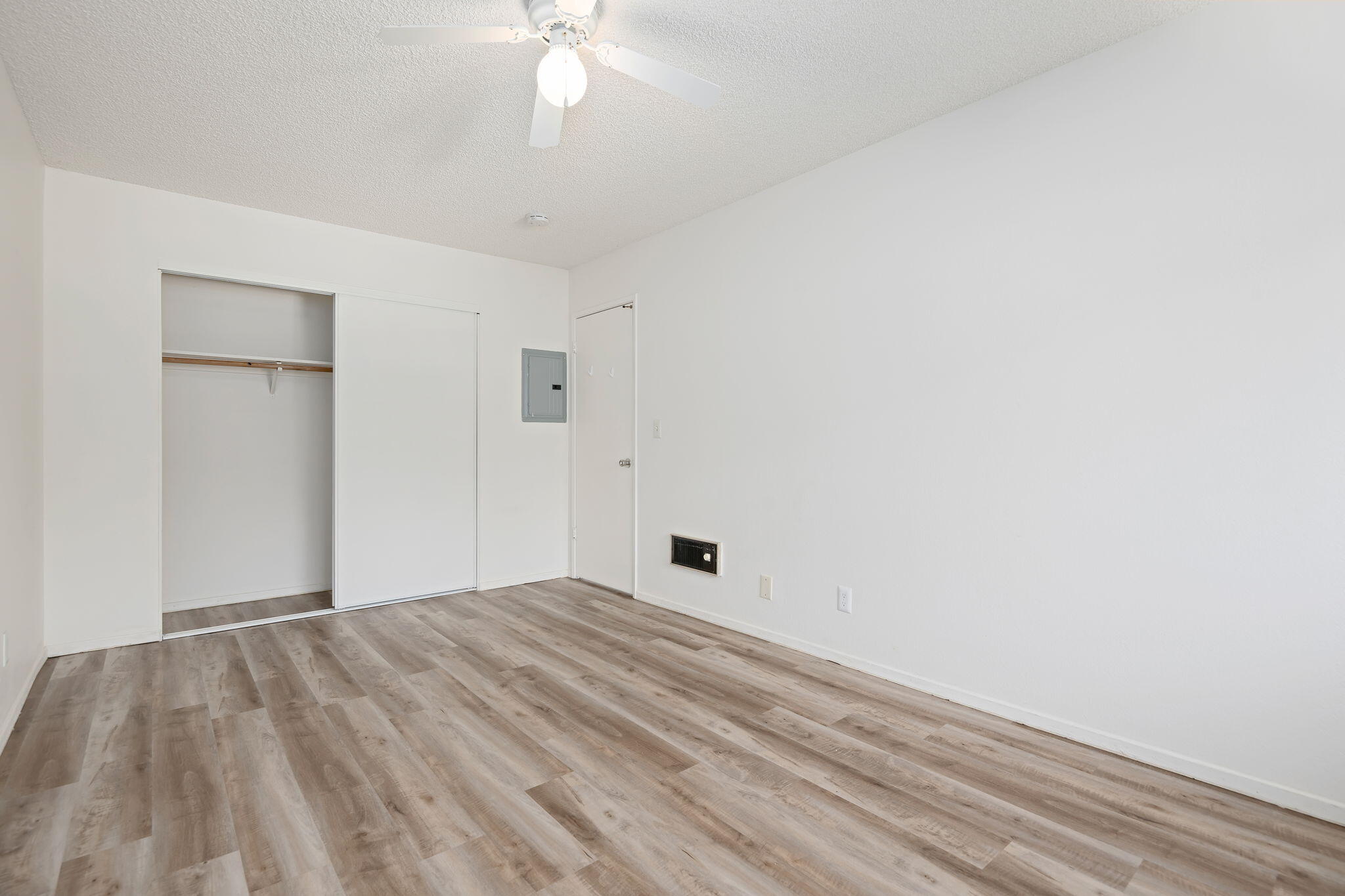1676 Maple Avenue, Unit 4 Solvang, CA 93463 - Photo 5 of 16 a view of a bedroom with a bed and a chandelier fan