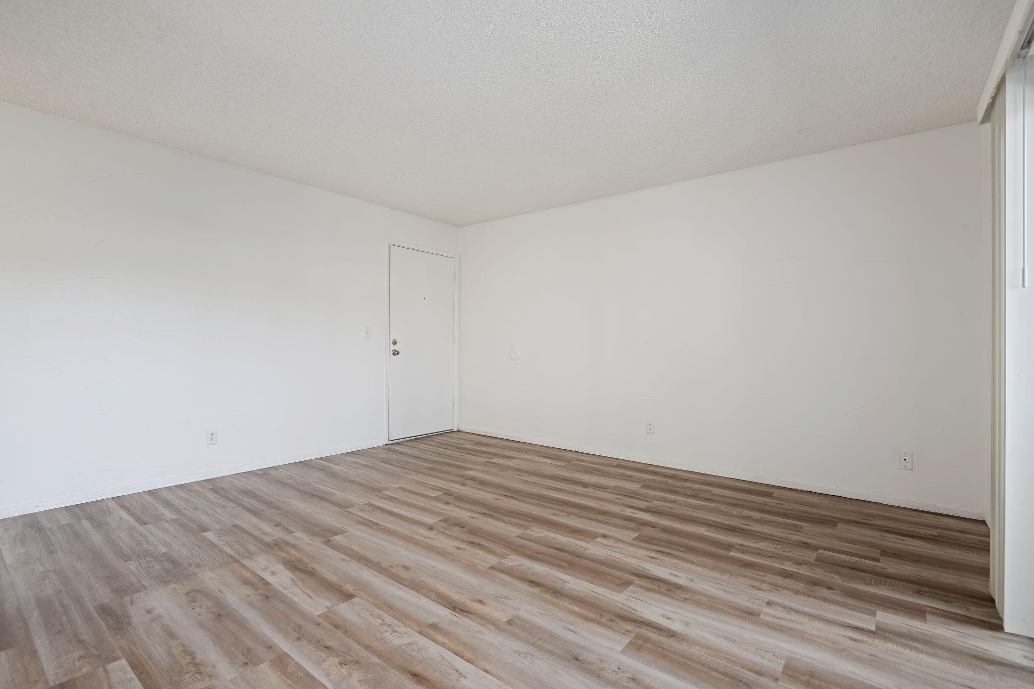 1676 Maple Avenue, Unit 4 Solvang, CA 93463 - Photo 9 of 16 a view of empty room with wooden floor