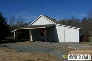 2823 Price Rushing Road Monroe, NC 28110 - Photo 3 of 6 a view of a barn with a yard