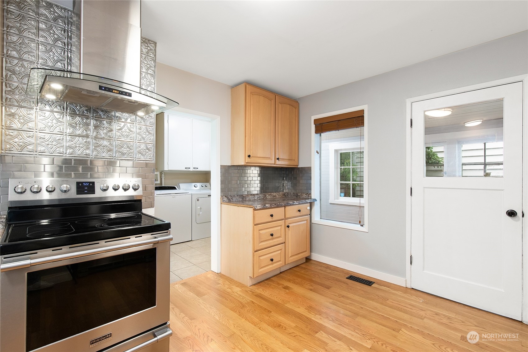 2934 Cedar Street Everett, WA 98201 - Photo 20 of 35 a kitchen with stainless steel appliances white cabinets and a stove