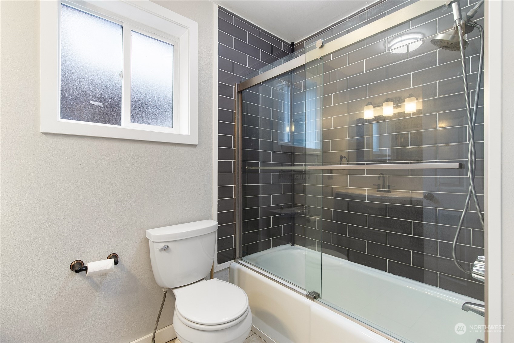 2934 Cedar Street Everett, WA 98201 - Photo 22 of 35 a bathroom with a bathtub and toilet