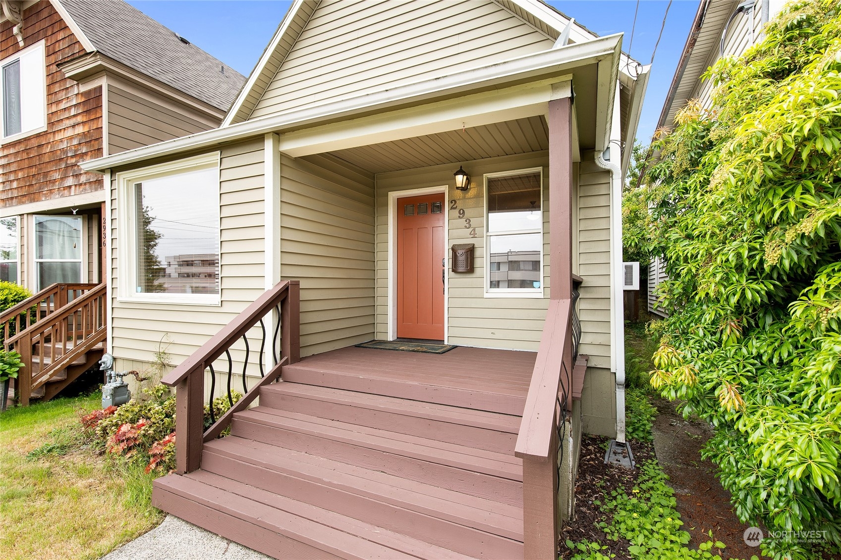 2934 Cedar Street Everett, WA 98201 - Photo 3 of 35 a view of a house with wooden stairs and floor to ceiling windows and stairs