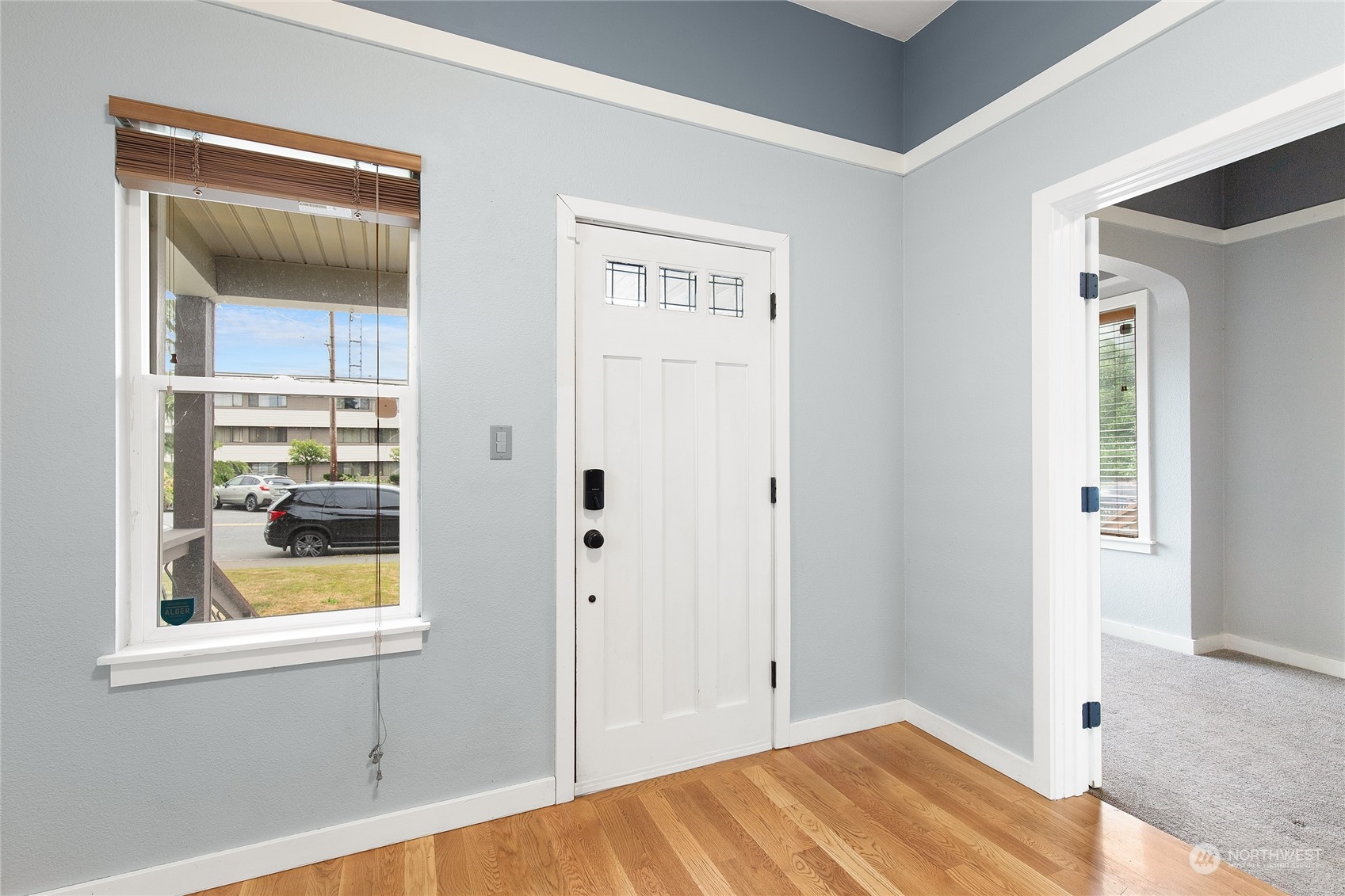 2934 Cedar Street Everett, WA 98201 - Photo 5 of 35 a view of an empty room with wooden floor and a window