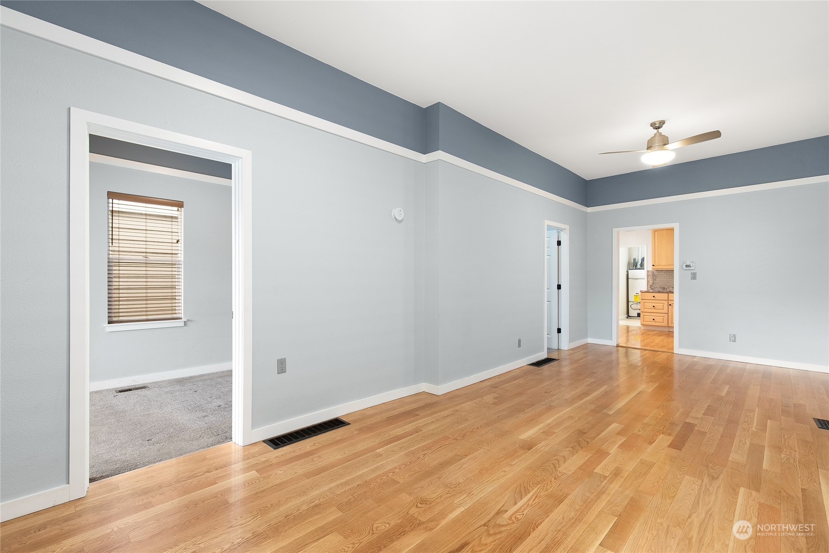 2934 Cedar Street Everett, WA 98201 - Photo 7 of 35 a view of an empty room with wooden floor and a window
