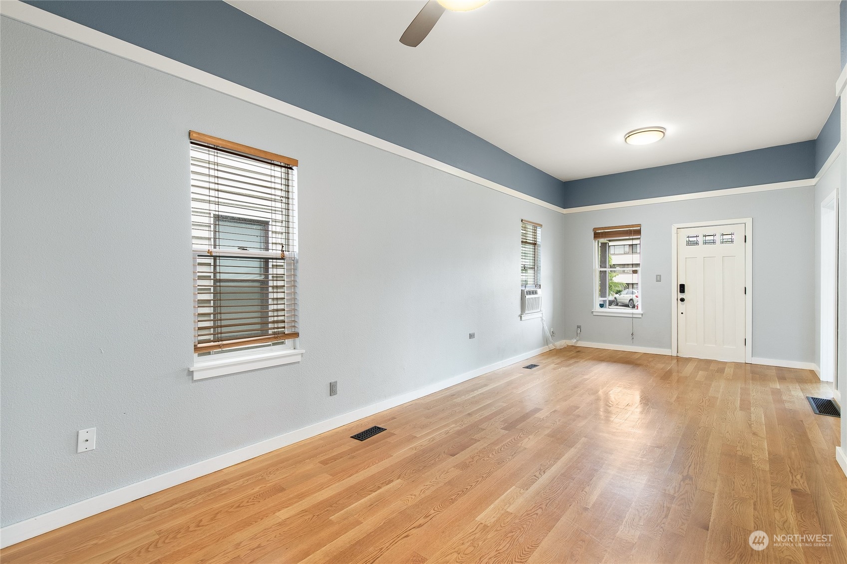 2934 Cedar Street Everett, WA 98201 - Photo 8 of 35 a view of an empty room with wooden floor and a window