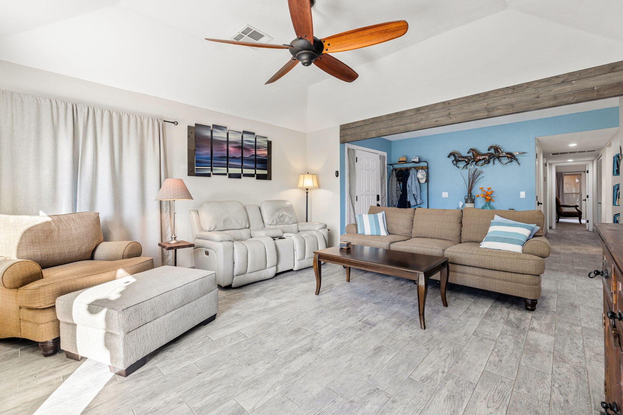82191 Ullman Road Indio, CA 92201 - Photo 11 of 40 a living room with furniture and a large window