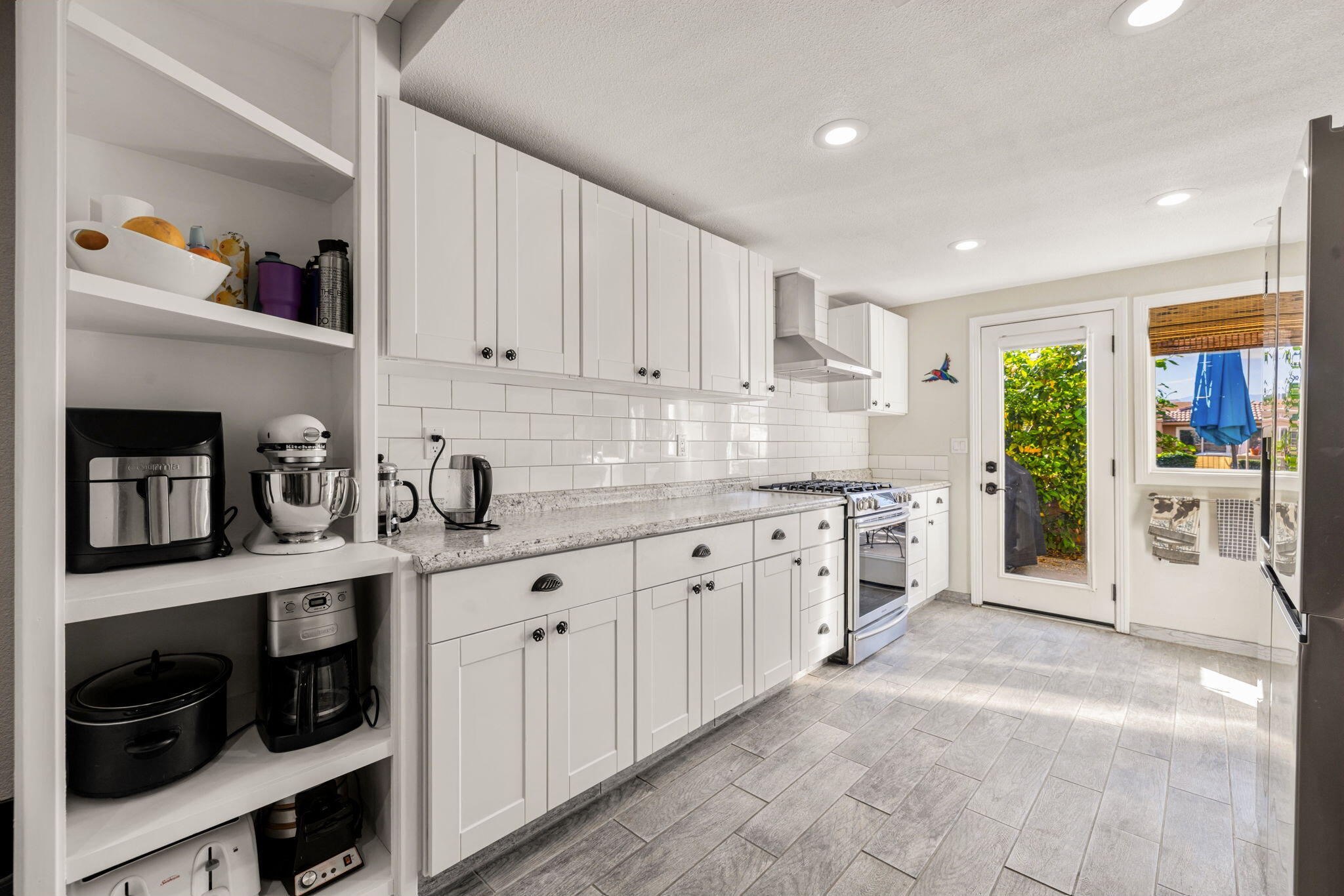 82191 Ullman Road Indio, CA 92201 - Photo 16 of 40 a large kitchen with cabinets