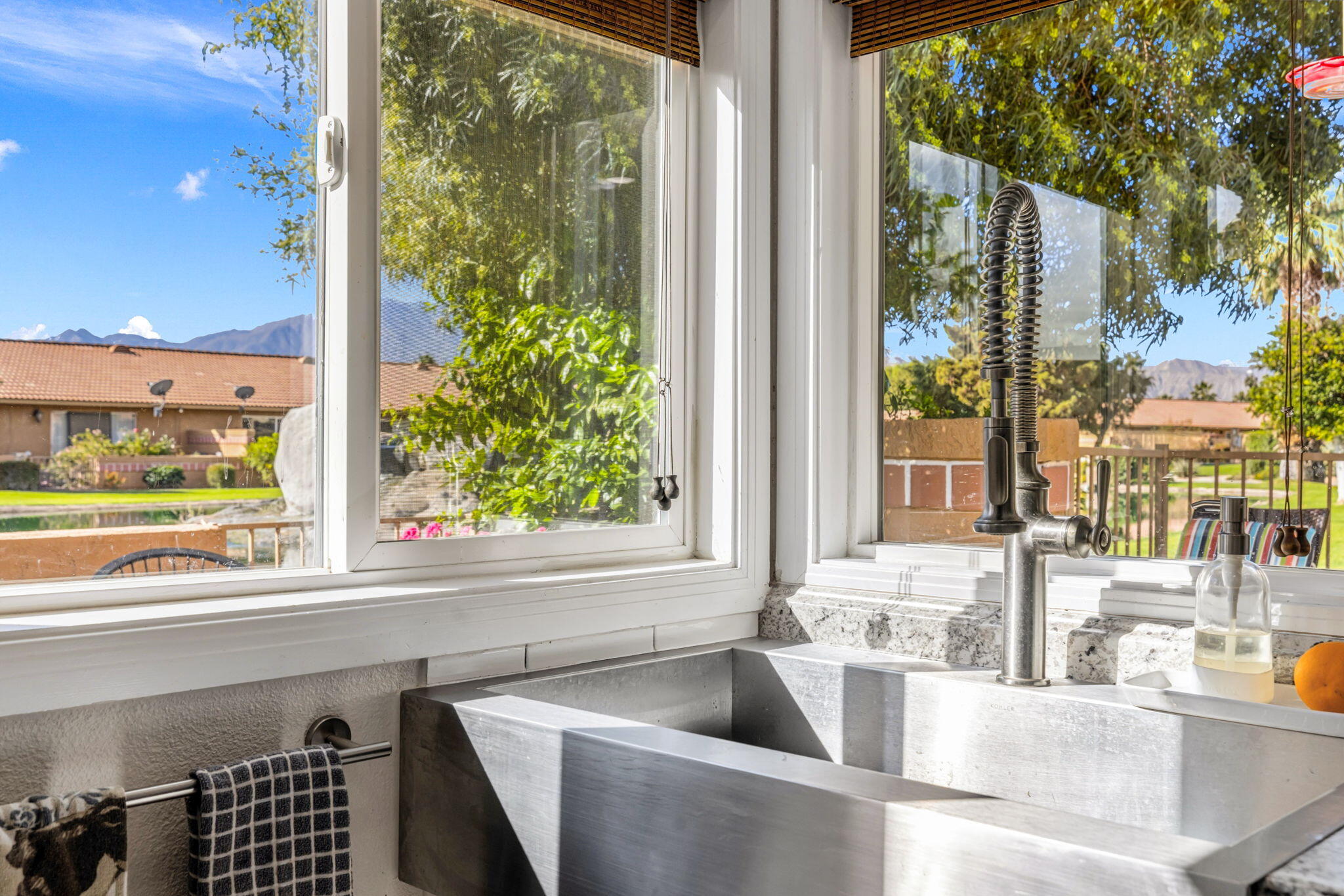 82191 Ullman Road Indio, CA 92201 - Photo 18 of 40 a view of a kitchen with a sink and large window