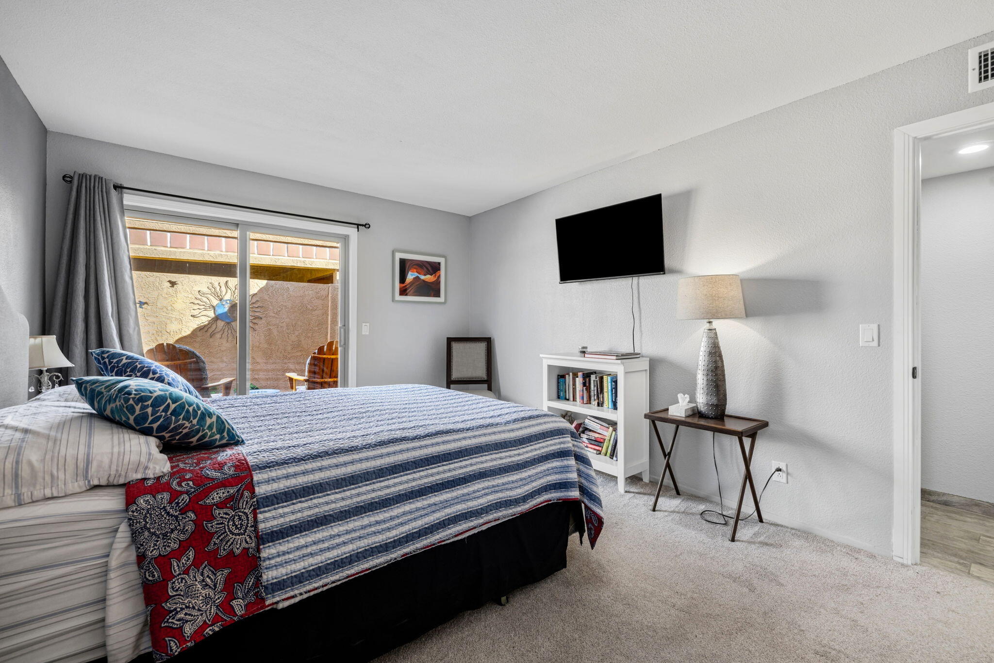 82191 Ullman Road Indio, CA 92201 - Photo 23 of 40 a bedroom with a bed and a flat screen tv
