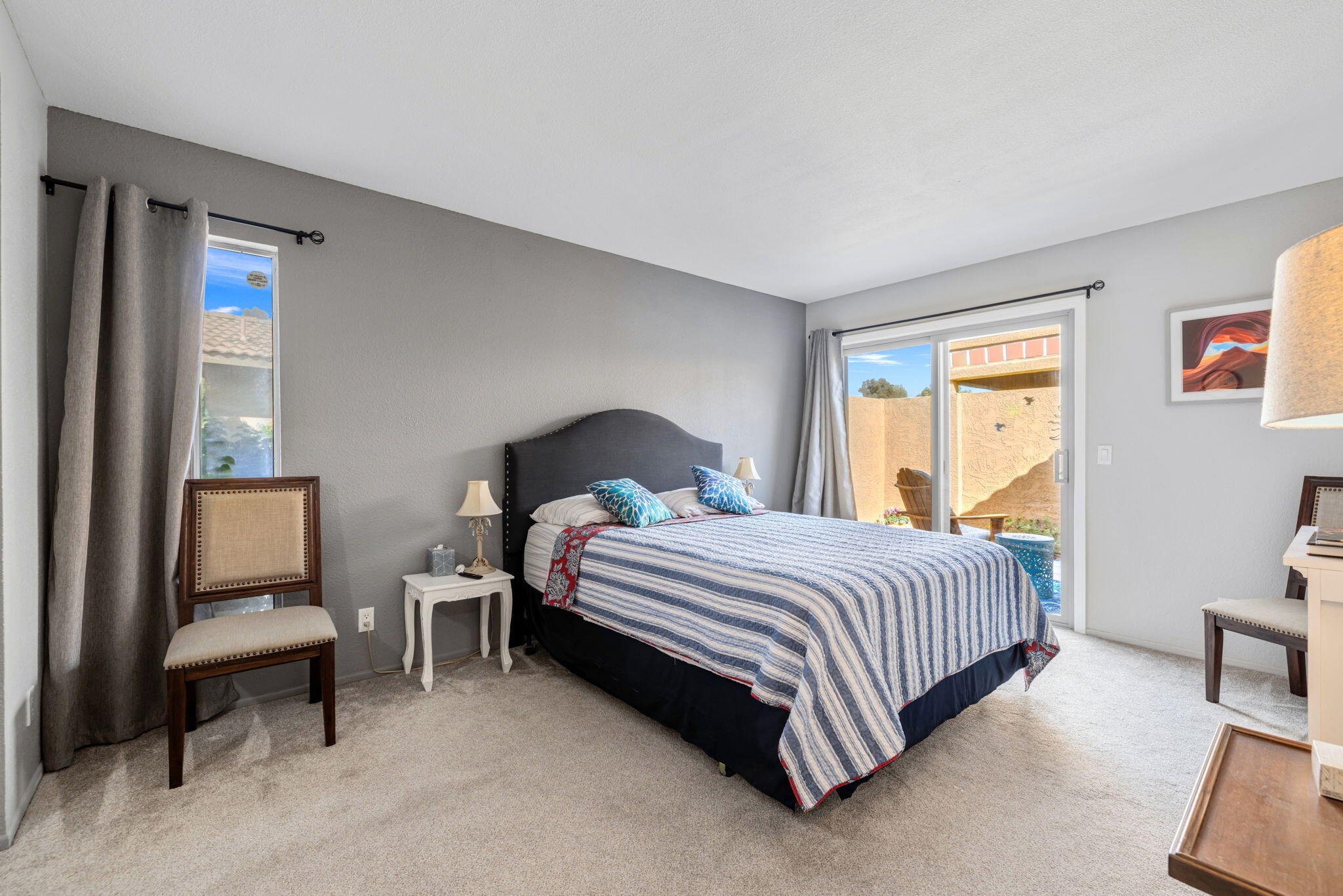 82191 Ullman Road Indio, CA 92201 - Photo 24 of 40 a bedroom with a bed chair and a window