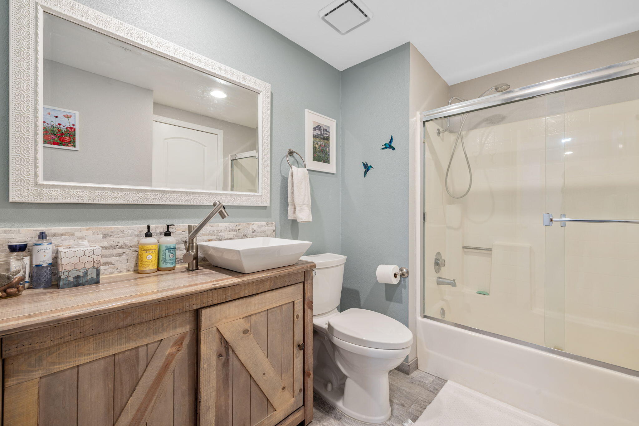 82191 Ullman Road Indio, CA 92201 - Photo 27 of 40 a bathroom with a granite countertop sink a toilet and shower