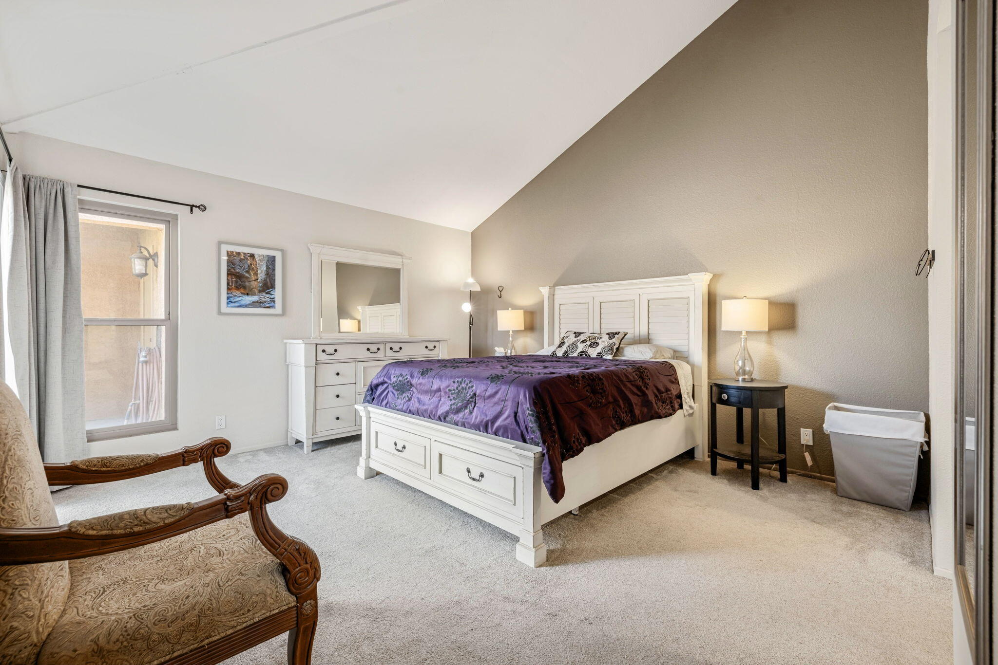 82191 Ullman Road Indio, CA 92201 - Photo 30 of 40 a bedroom with a bed chairs and window