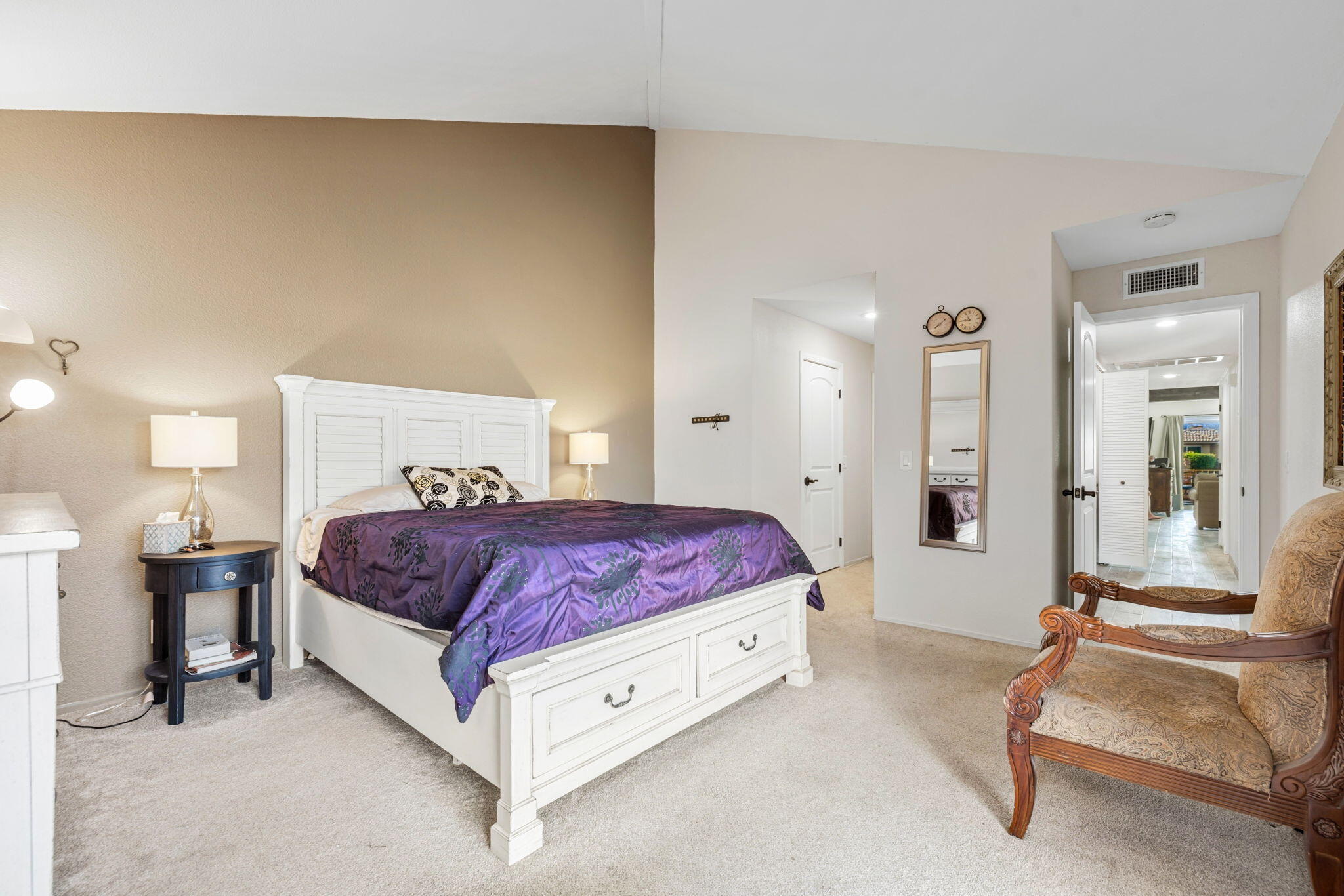 82191 Ullman Road Indio, CA 92201 - Photo 31 of 40 a spacious bedroom with a bed a table and chair