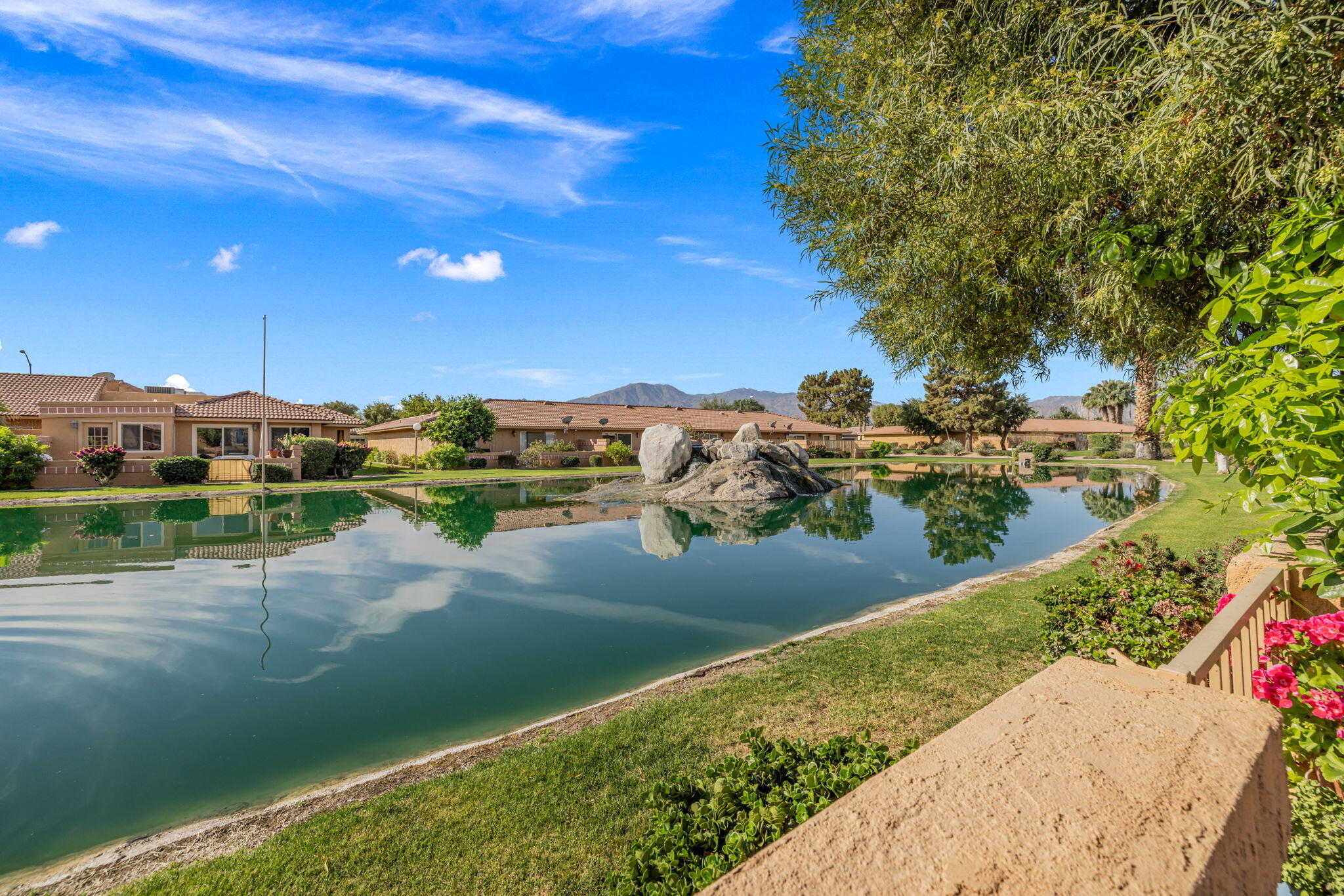 82191 Ullman Road Indio, CA 92201 - Photo 35 of 40 a view of a lake with a yard