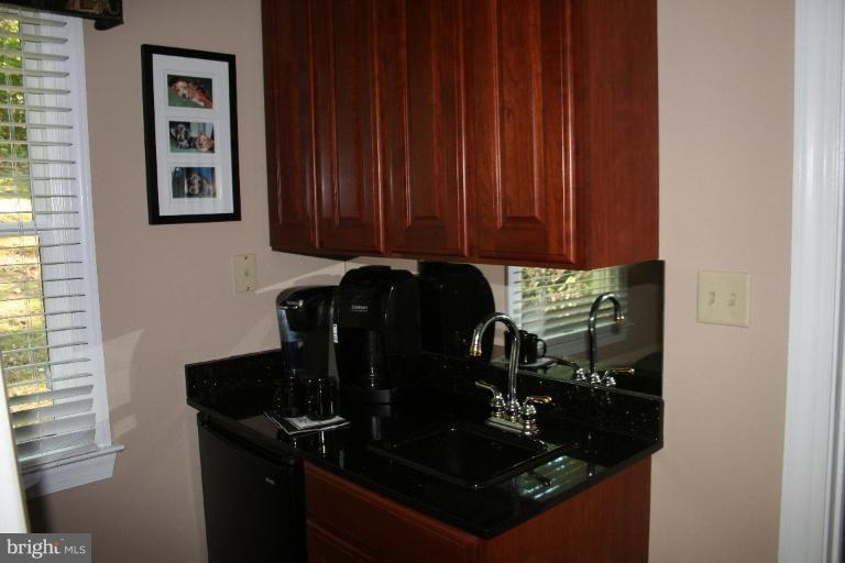 3491 Godspeed Road Davidsonville, MD 21035 - Photo 11 of 30 Coffee bar w/ granite countertop & refrigerator