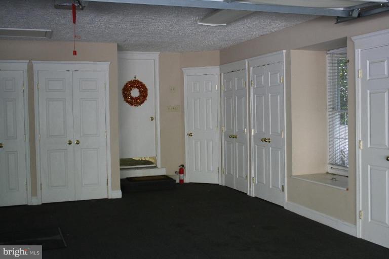 3491 Godspeed Road Davidsonville, MD 21035 - Photo 26 of 30 Carpeted 2-car garage w/built-in storage closets