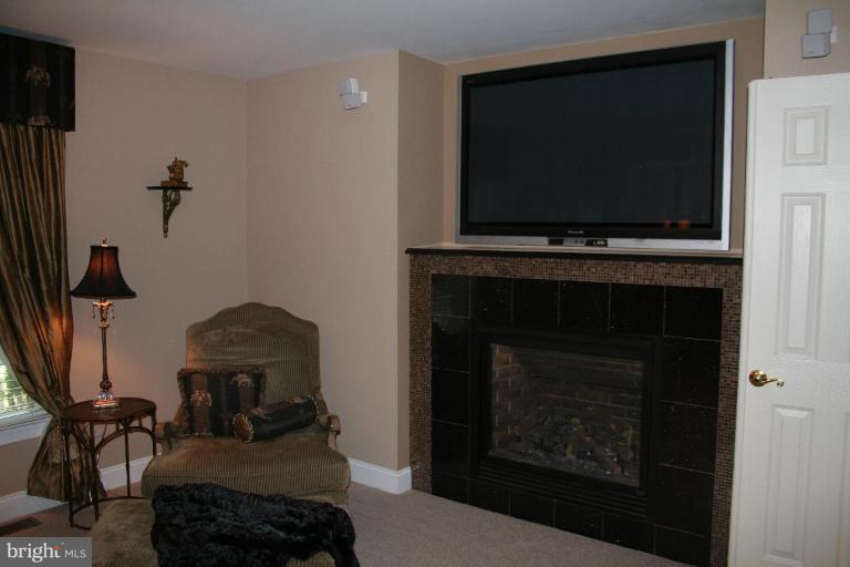 3491 Godspeed Road Davidsonville, MD 21035 - Photo 9 of 30 Gas fireplace w/ tile & surround sound speakers