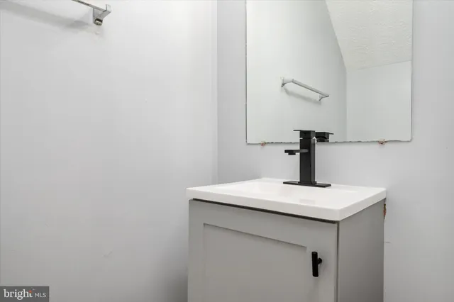 a close up of a sink and a mirror