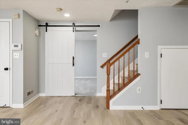 a view of a hallway with staircase