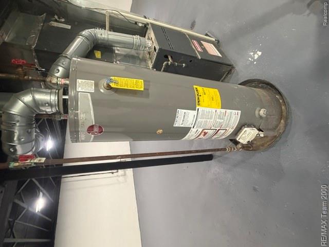 580 Palmerston Street River Rouge, MI 48218 - Photo 16 of 19 Water heater system with associated ductwork and piping, situated on a gray painted concrete floor