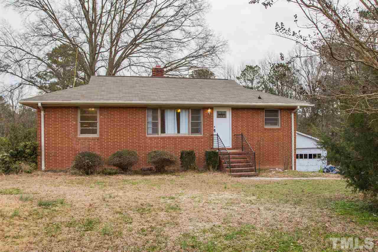 325 Hocutt Road Durham, NC 27703 - Photo 1 of 22 a front view of a house with garden