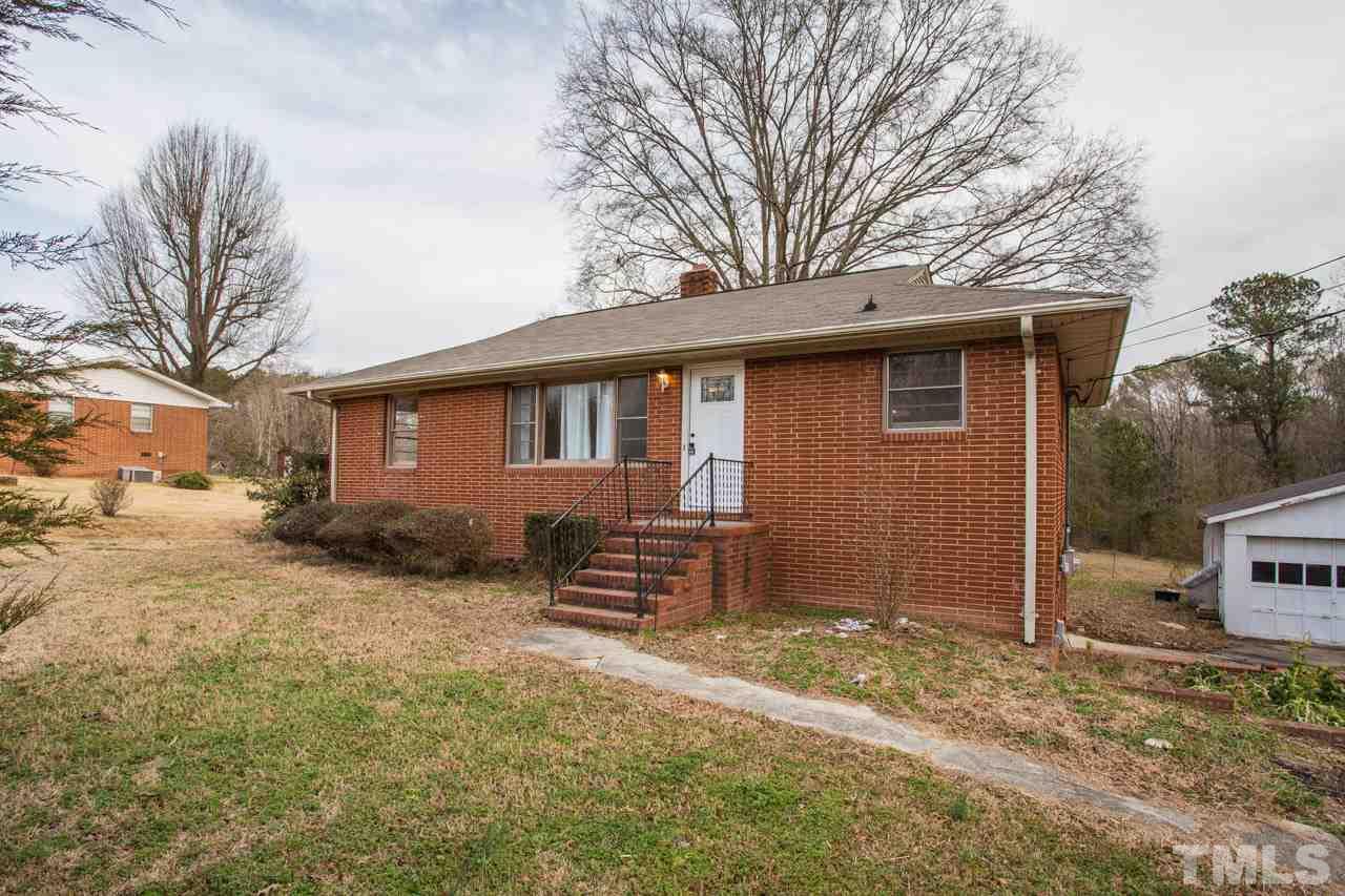 325 Hocutt Road Durham, NC 27703 - Photo 2 of 22 a view of a house with a yard covered in snow