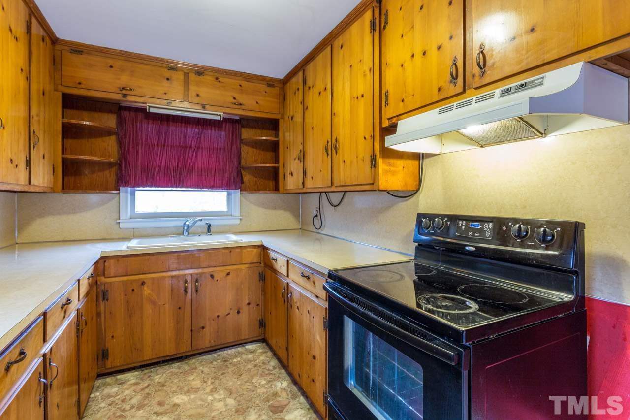 325 Hocutt Road Durham, NC 27703 - Photo 12 of 22 a kitchen with a stove and a sink