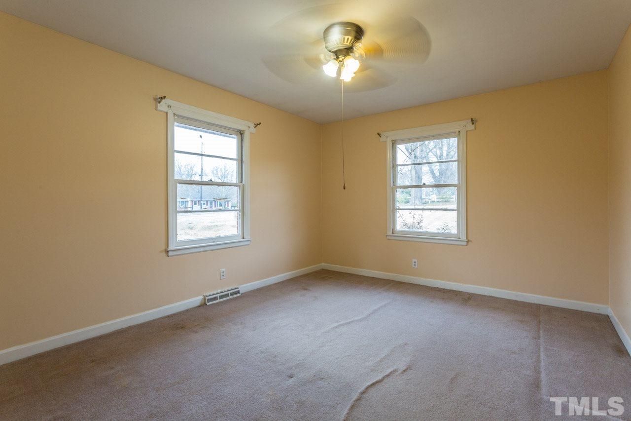 325 Hocutt Road Durham, NC 27703 - Photo 14 of 22 an empty room with a window