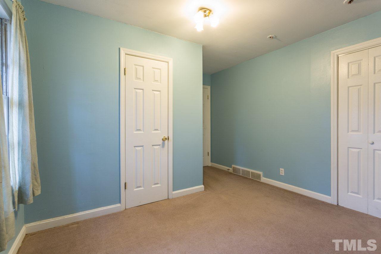 325 Hocutt Road Durham, NC 27703 - Photo 17 of 22 an empty room with windows