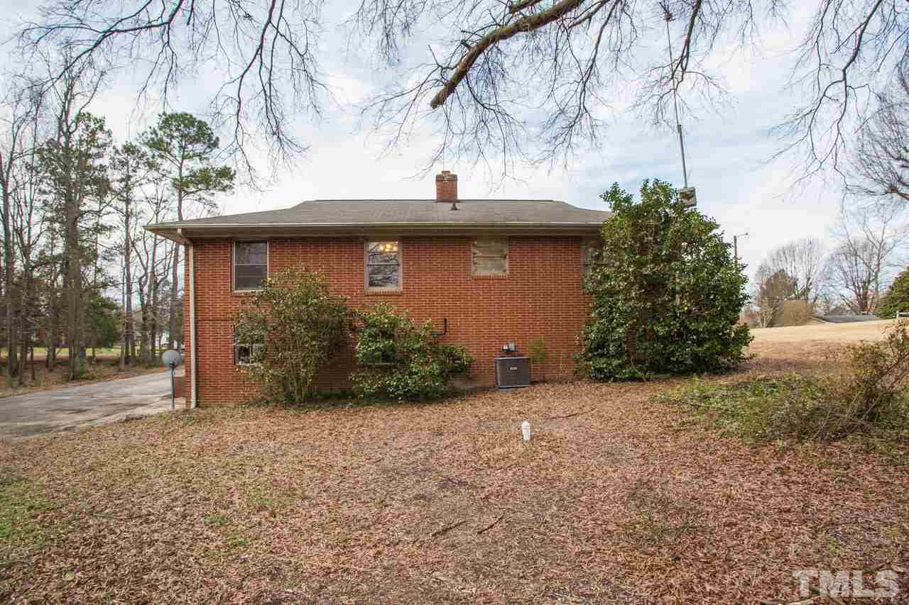 325 Hocutt Road Durham, NC 27703 - Photo 3 of 22 a view of a house with a tree