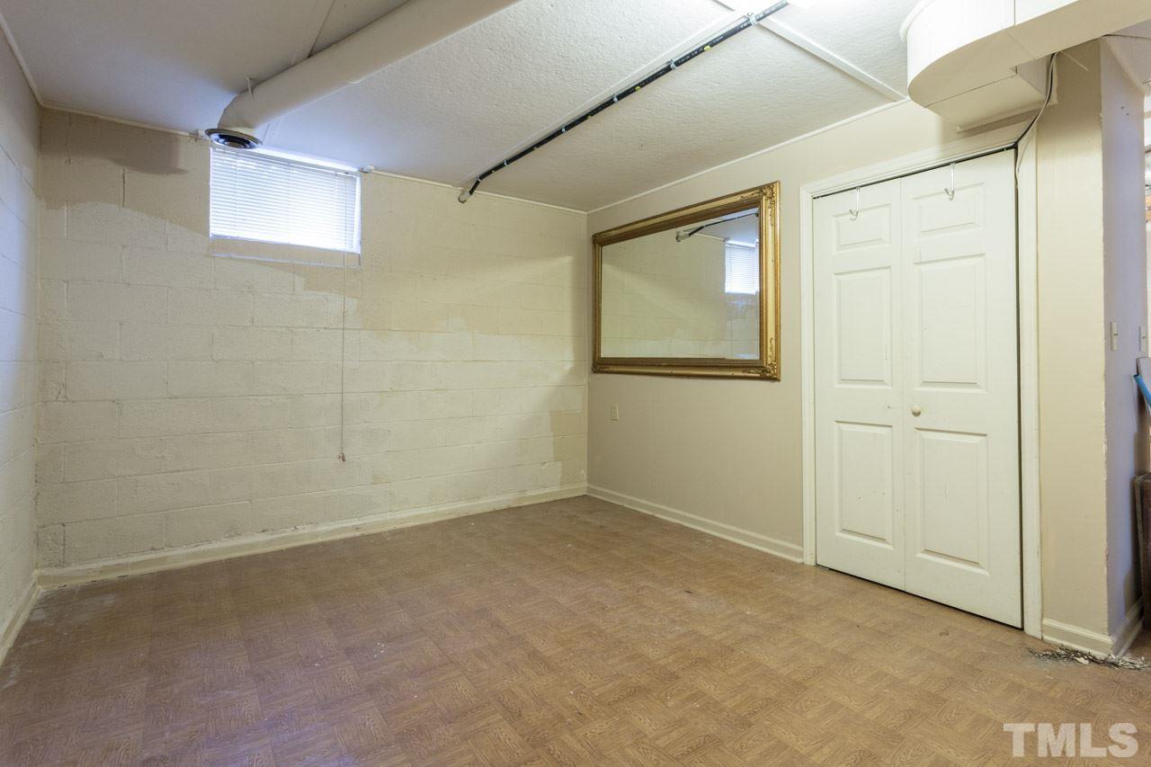325 Hocutt Road Durham, NC 27703 - Photo 21 of 22 an empty room with windows