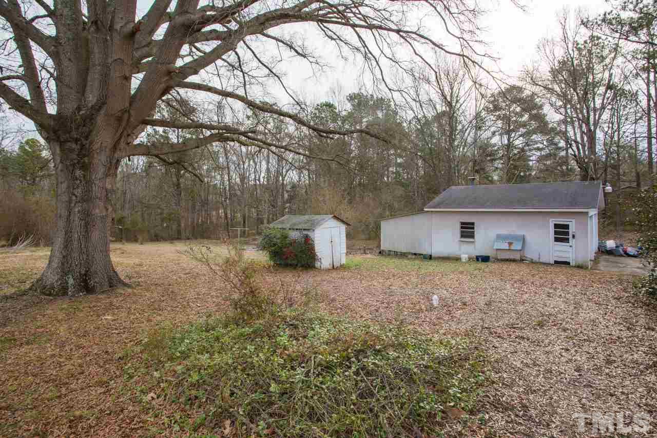 325 Hocutt Road Durham, NC 27703 - Photo 4 of 22 a house that has a tree in front of it