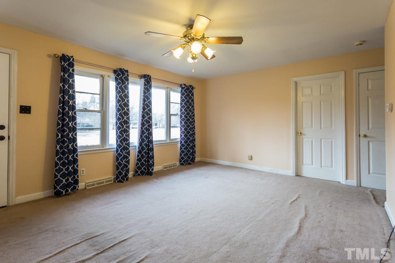 325 Hocutt Road Durham, NC 27703 - Photo 6 of 22 a view of an empty room with a window