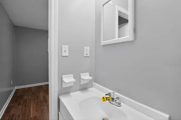a bath room with a toilet and a sink