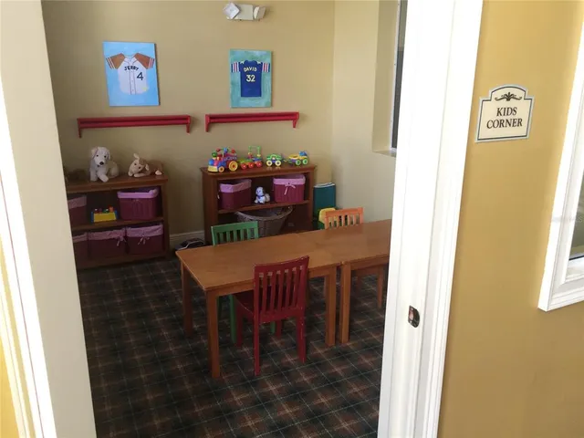 a view of a dining room with furniture and window