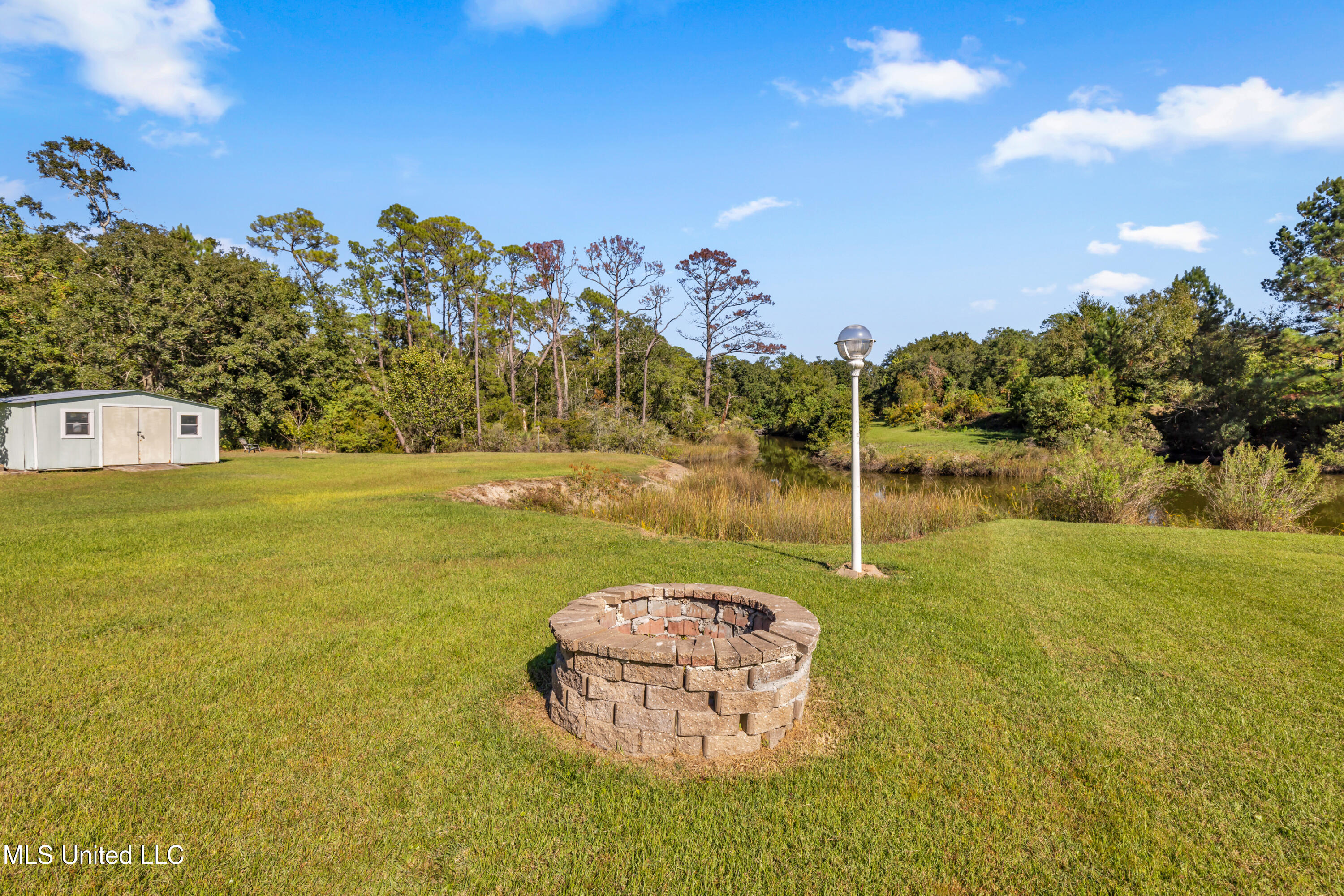 6720 Tunica Road Biloxi, MS 39532 - Photo 33 of 44 fire pit and space for dock or pier
