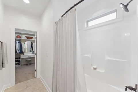 a bathroom with a tub and shower