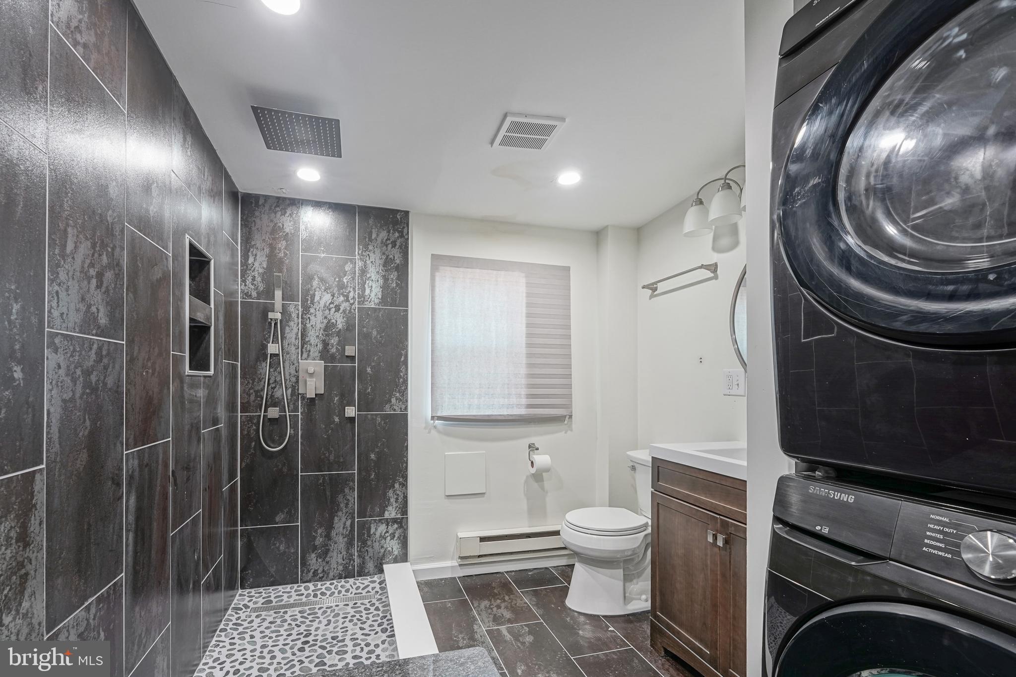 1929 North 9th Street Philadelphia, PA 19122 - Photo 11 of 49 a bathroom with a toilet a sink and a shower