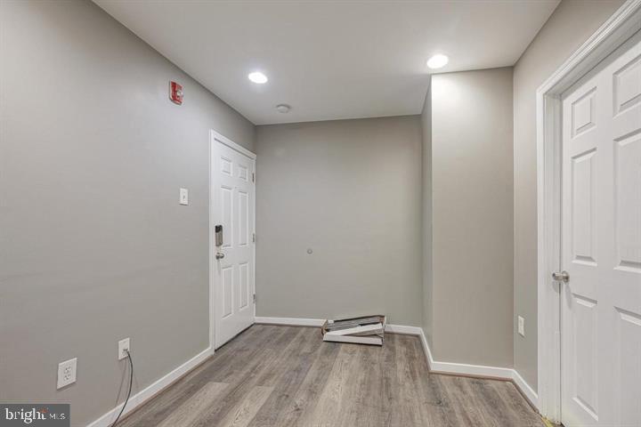 1929 North 9th Street Philadelphia, PA 19122 - Photo 25 of 49 a view of room with walk in closet and wooden floor