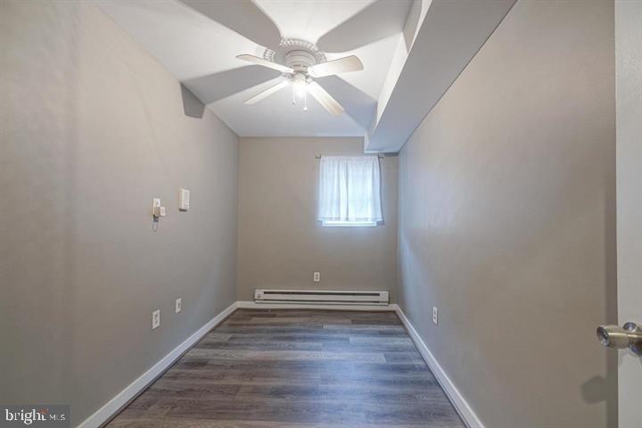 1929 North 9th Street Philadelphia, PA 19122 - Photo 29 of 49 an empty room with wooden floor and windows