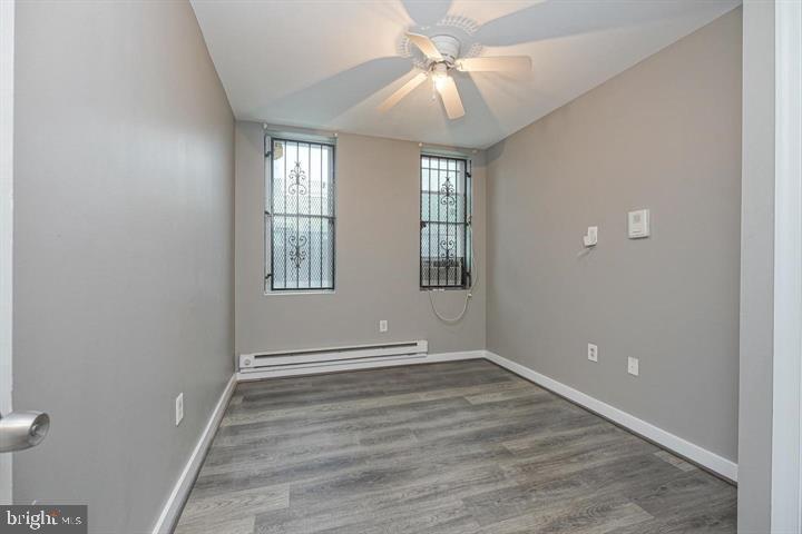 1929 North 9th Street Philadelphia, PA 19122 - Photo 32 of 49 a view of empty room with wooden floor and fan
