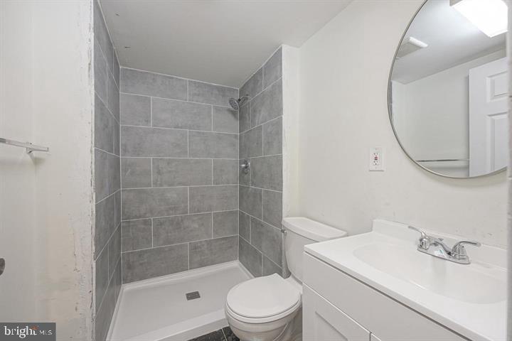 1929 North 9th Street Philadelphia, PA 19122 - Photo 34 of 49 a bathroom with a sink a toilet and shower