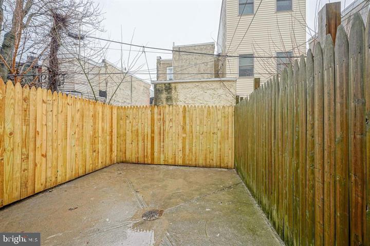 1929 North 9th Street Philadelphia, PA 19122 - Photo 39 of 49 a view of a building with wooden fence