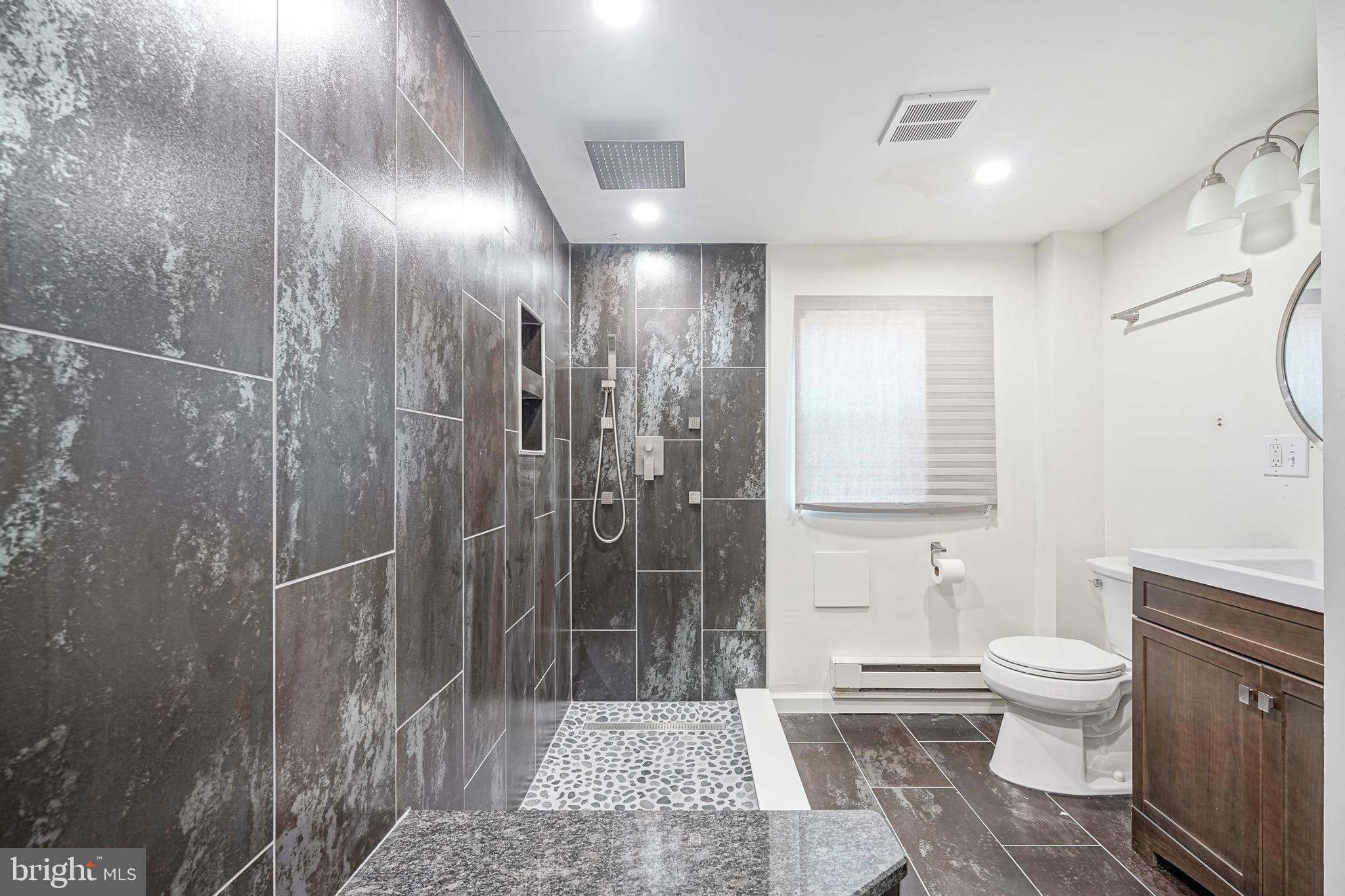 1929 North 9th Street Philadelphia, PA 19122 - Photo 43 of 49 a bathroom with a shower and a toilet